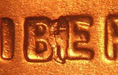 2015 penny BIE die crack error showing raised vertical line between B and E in LIBERTY resembling an extra I